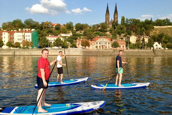 Stand-Up Paddleboarding on the Vltava River in Prague - The Prague Castle and Charles Bridge panorama from water
